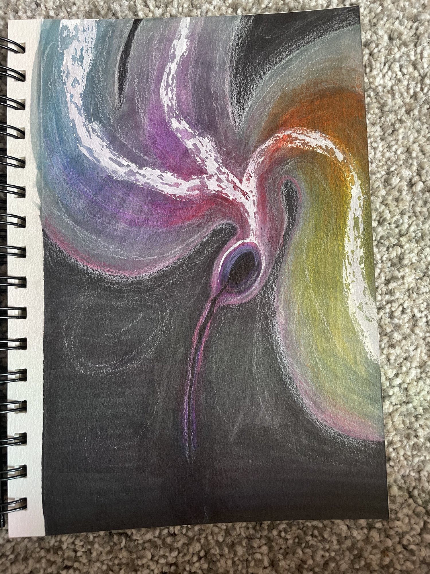Soft pastel abstract with a swirling rainbow form against dark grey