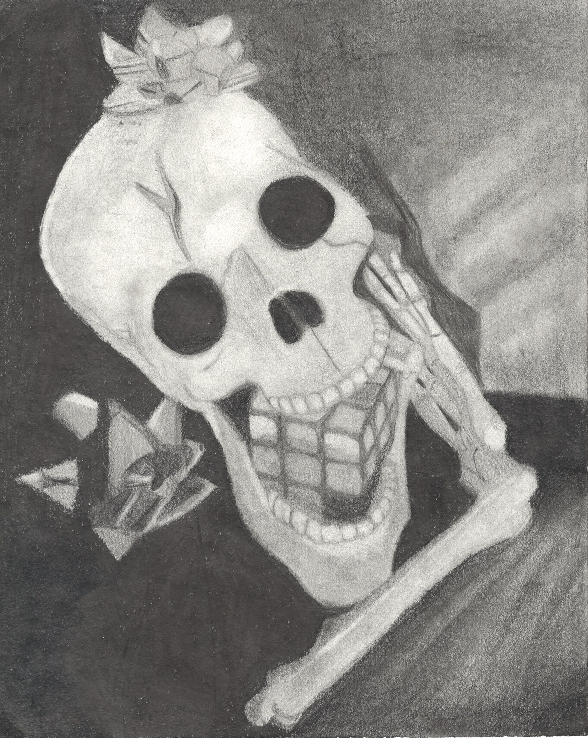 Charcoal drawing of a human skull at an angle with dramatic light and shadow