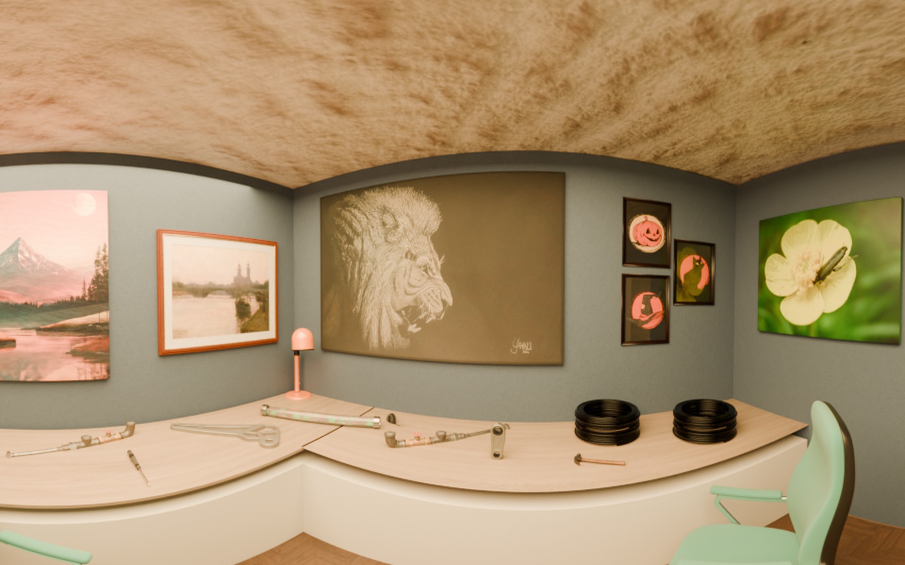 Studio with a curved white workbench, tools, and framed artwork on a blue-grey wall